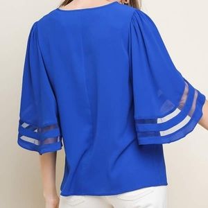 Pretty blue top with fun sleeves